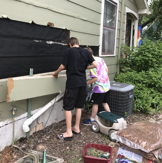 Boys Tearing Off Siding