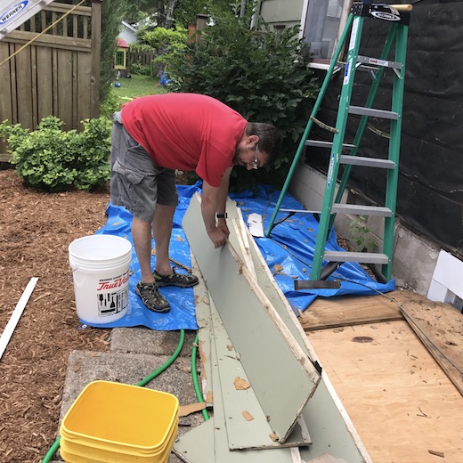 Teacher Holding Siding